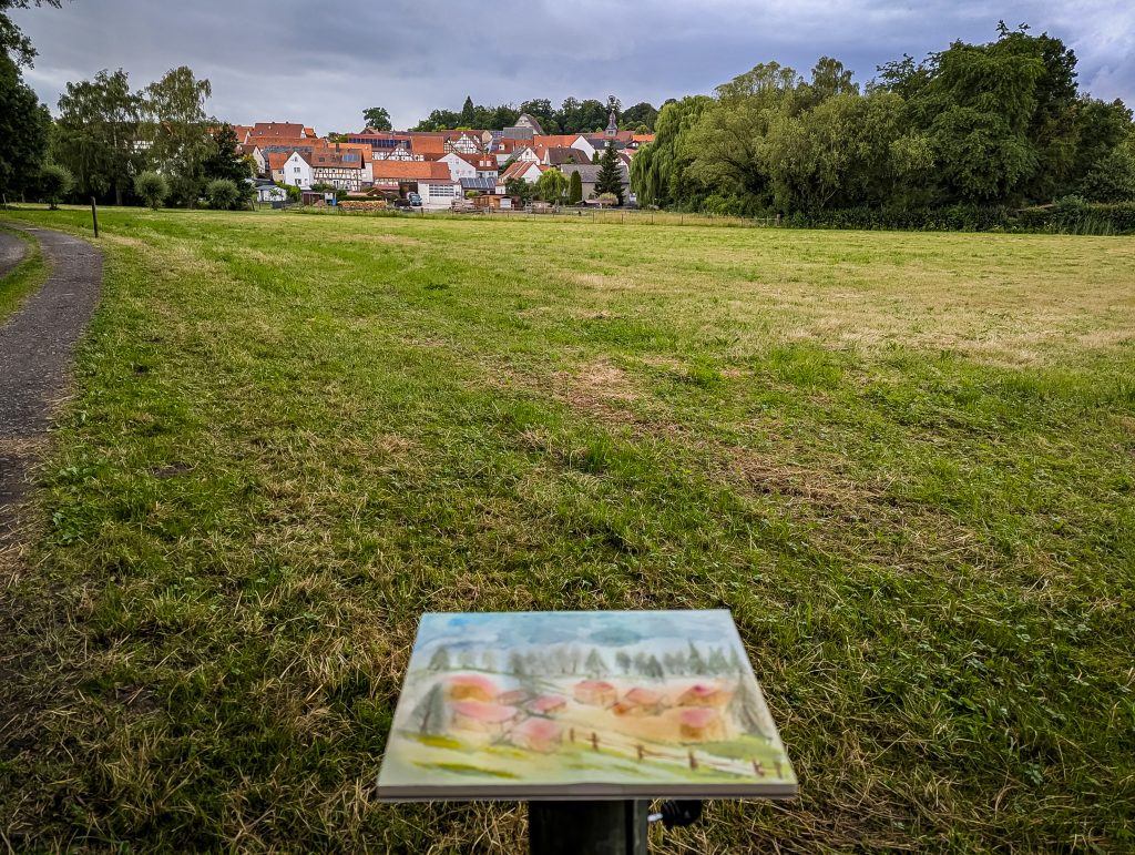 Aquarell und Blick auf das Dorf